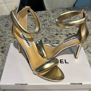 Women gold heels, brand new.